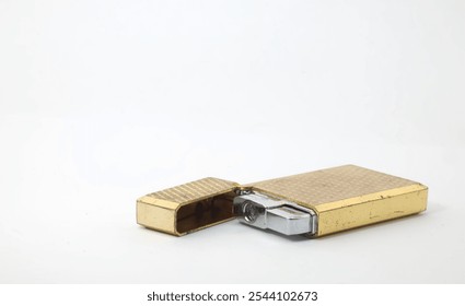 Front view of a gold lighter on a white background. - Powered by Shutterstock