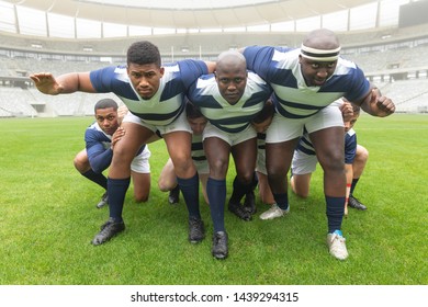 Front view of group of diverse male rugby players ready to play rugby match in stadium - Powered by Shutterstock