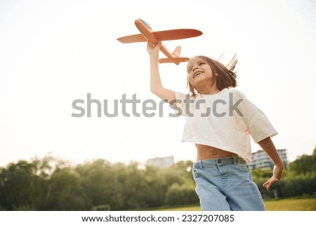 Similar – Image, Stock Photo Positive girl in plane near window