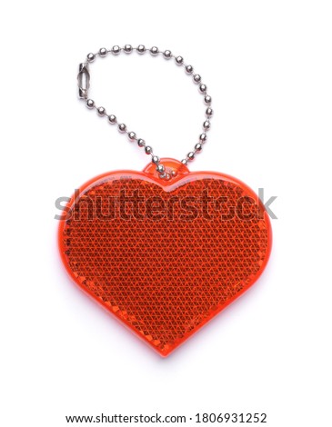 Front view of heart shaped safety reflector isolated on white