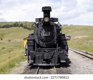 A Front View of Historic Steam Locomotive 489 with a Lit Headlight