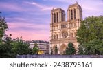 Front view of illuminated Notre Dame De Paris cathedral day to night transition timelapse after sunset. Colorful sky on a background. Paris, France, Europe. View from Cardinal Lustiger bridge.