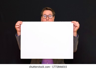 Front View Image Of Caucasian Business Man Holding Hide And Seek In Advertisements A Blank Banner Isolated On Black Studio Background