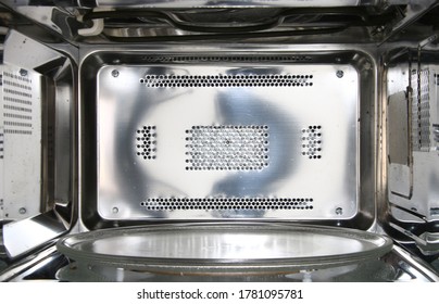 Front  View Inside Of Empty Clean Microwave Oven Interior
