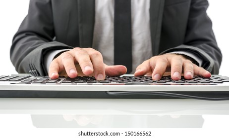 Front View Of Insurance Agent Typing On Computer On His White Office Desk. 
