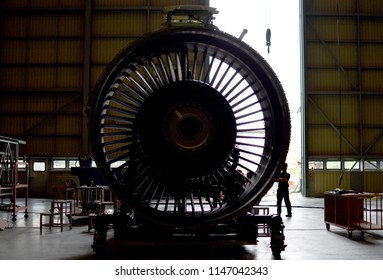Front view of jet engine removed from aircraft (airplane) for maintenance and service all part and component .Jet engine maintenance at aircraft hangar by aircraft technician for safety.