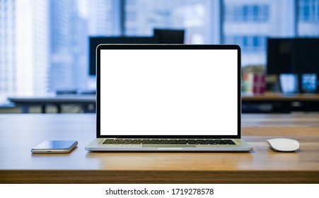 front view of laptop with blank screen on the table with mouse and mobile phone