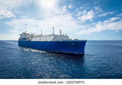 Front View Of A Large LNG Or Liquid Gas Tanker Ship Traveling With Speed Over Blue Ocean