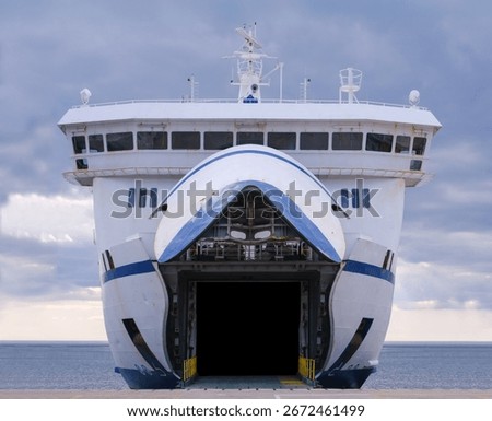 Front View Of A Large Roll-On Roll-Off Ferry (Ro-Ro Ship) Docked At Port With Its Bow Door Open For Vehicles And Passengers, Maritime Transport And Travel Concept