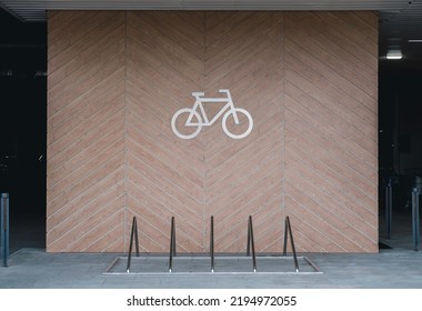 Front view of a large sign for bicycle parking on the wall. Bicycle parking in city. - Powered by Shutterstock