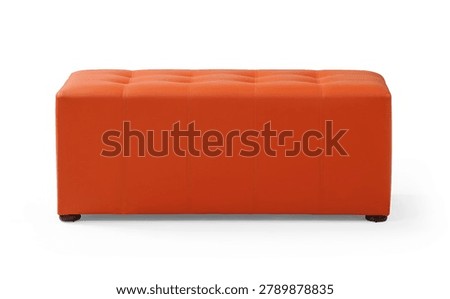 Front view of a long rectangular orange leather bench ottoman with a tufted button seat, isolated on a white background.