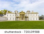 front view of majestic dundurn castle in city of hamilton in ontario canada blue sky clouds park area green grass