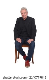 Front View Of A Man Sitting  On Chair With Sneakers Jeans And Blazer On White Background