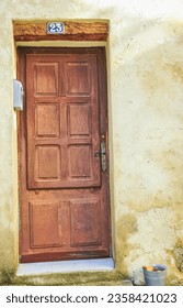 front view, medium distance, solid, brown, wood, eight paneled,1800's  front door
