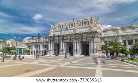 Front view of Milan antique central railway station timelapse hyperlapse. Blue cloudy sky at summer day. The station was inaugurated in 1931.