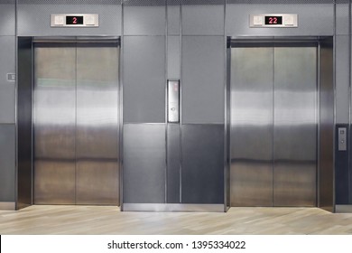 Front View Of Modern Elevator With Closed Doors In Lobby