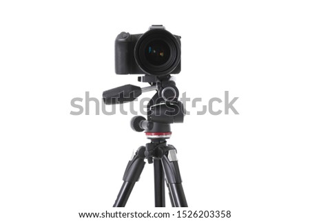 Front view of modern multifunctional black camera on trepied isolated