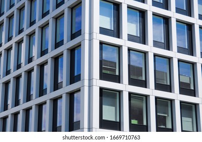 Front view of modern office building windows for background. 
Steel frame and glass windows architecture. Real estate business concept. Office for rent. Rent and sell concept. The urban landscape.