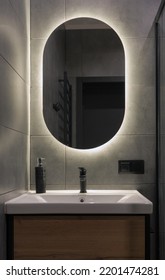 Front View Of Modern Oval Shape Bathroom Mirror With Back Light 