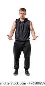 Front View Of Muscled Young Man Holding Something In Front Of Him Looking Down Isolated On White Background. Carrying Things. Sport And Bodybuilding. Working Out.