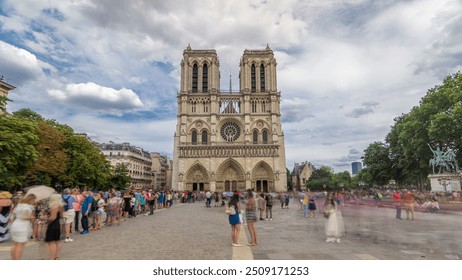 Front view of Notre-Dame de Paris timelapse hyperlapse. Medieval Catholic cathedral on the Cite Island in Paris, France. Long queue of tourists at the entrance. Cloudy sky at summer day - Powered by Shutterstock