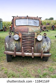 A Front View Of An Old Farm Truck