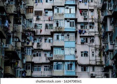 Front view of old residential city apartment block. Hong Kong cityscape downtown.