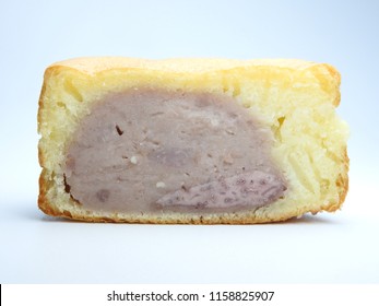 Front view of one taro-flavored wheel pie ( also called custard pancake)  isolated. Wheel pie is a popular snack in Taiwan. Taiwanese food concept. Dessert time. Texture of ingredients.