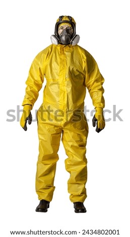 Front view of a person clad in a full yellow hazmat suit with safety goggles and mask