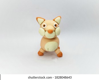 Front view of Plasticine statue 
wolf character on a white background.