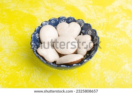 front view plate with cookies white colred cookies on the yellow background cookie biscuit sugar sweet