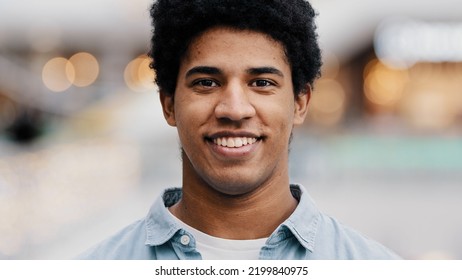 Front View Portrait Male Face Close-up African Millennial Man Guy Looking At Camera Smiling Waving Nods Head Answering Yes Positive Decision Agreement Support Approval Good Idea Agree Indoors Portrait