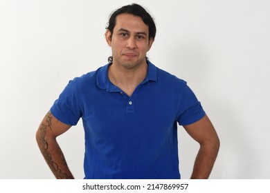 Front View Of A Portrait Of A Man With Tatoo On Looking At Camera On White Background