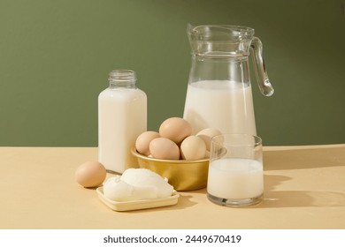 A front view presenting essential cooking or baking ingredients include milk, butter and eggs - neatly arranged on a kitchen counter. Cooking concept for designing - Powered by Shutterstock