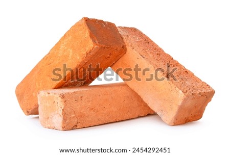 Front view of red or orange bricks in stack is isolated on white background with clipping path.