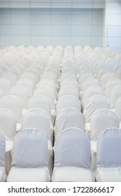 Front View Of Rows Of White Chairs Standing In An Auditorium, Empty Many Row Of Seat In White Room Design For Seminar Or Conferences, Business. Before The Event. 