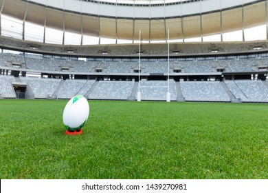 Front view rugby ball on a stand in a empty stadium - Powered by Shutterstock