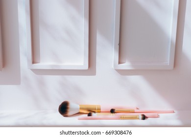 Front View Of Set Duo Fiber Brushes For Applying Face Makeup On Pink Background.Fashion, Beauty And Cosmetic Product, Tool Set. Vintage Tone.