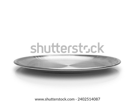 Front view of silver metal plate isolated on white background. Empty silver round flat plate with shadow. Mock up template for food poster design.