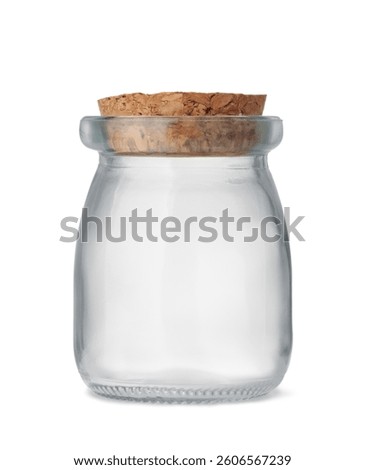 Front view of small empty glass jar with cork stopper isolated on white