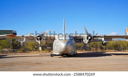 A Front View of a Small Twin Engine Military Transport Airplane