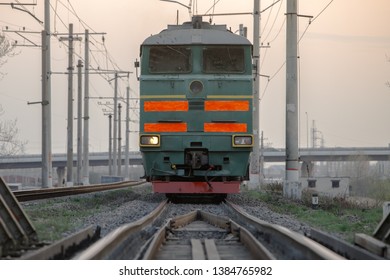 Front view of soviet powerful diesel locomotive on the railroad early morning. 