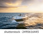 Front view of a sports motor boat cruising with high speed over the blue sea during summer sunset time