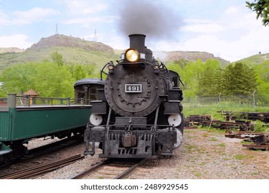 A Front View of Steam Locomotive 491 Steaming in a Train Yard - Powered by Shutterstock