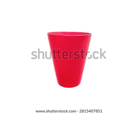 Front view studio shot of an empty reusable red plastic cup essential for party events isolated on clean white background
