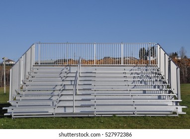 Front view of sturdy steel galvanized portable bleachers in the field