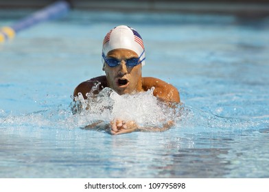 Front View Of A Swimmer In Motion During Swimming Race