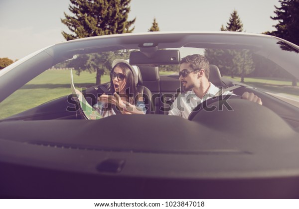 Front view through window of family, date journey\
trip, escape ride, vehicle rent. Married driver and frustrated lady\
are arguing, hold scheme, has no idea where to go, fault, guilt,\
accuse