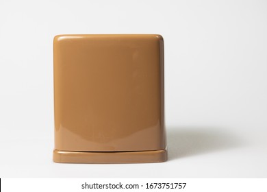 Front View Of Toilet Paper Or Tissue In Brown Rectangular Napkin Box On White Background