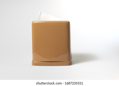 Front View Of Toilet Paper Or Tissue In Brown Rectangular Napkin Box On White Background